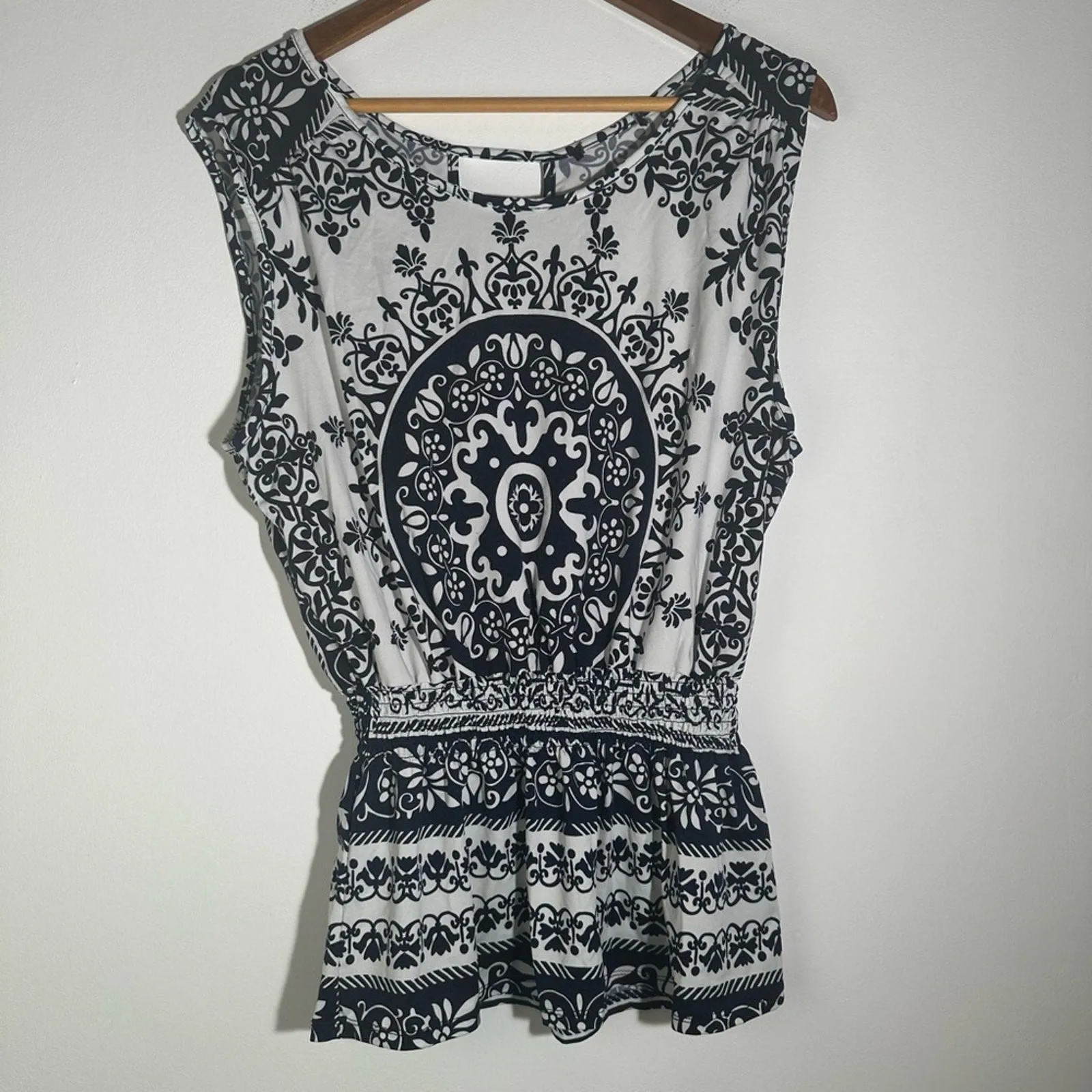 Black and White Peplum Blouse with Intricate Design