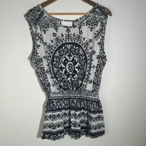 Black and White Peplum Blouse with Intricate Design
